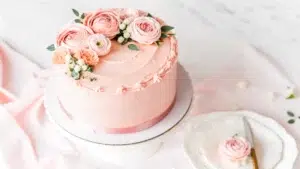 A collection of colorful edible flowers, including roses, pansies, and marigolds.