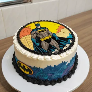 : A baker smoothing buttercream on a cake, with edible image tools nearby.