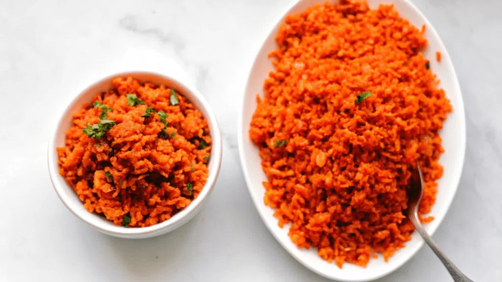 "Toasting long-grain white rice in a pan with oil, garlic, and onions for a rich, nutty flavor, the first step in making easy Mexican rice."